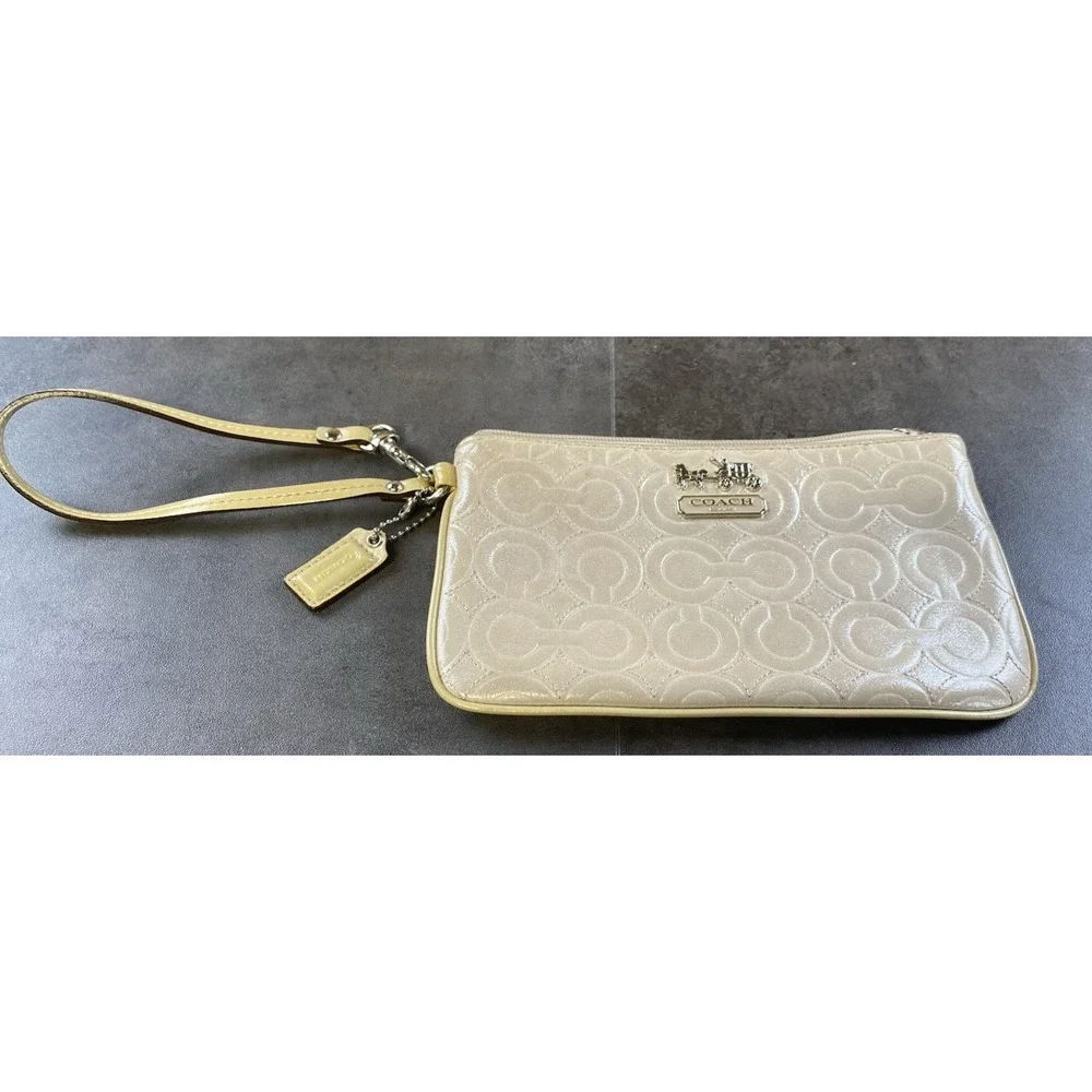 Coach Signature C Metallic Beige Wristlet w/ Purple Satin Interior